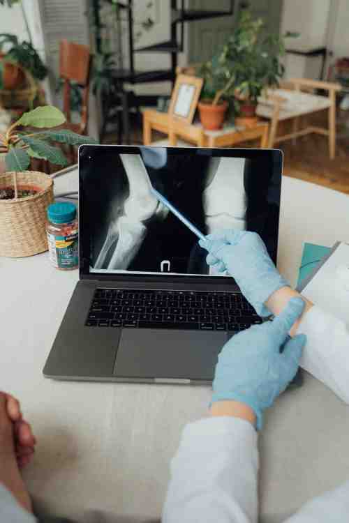 Physician examining digital radiographic images on a secure medical monitor