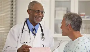 A secure virtual telehealth video appointment on a monitor illustrating digital healthcare